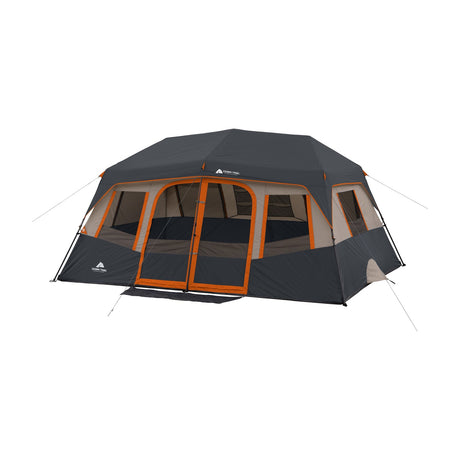 Ozark Trail 10-Person Instant Cabin Tent, 14' x 10', 2 Rooms — Ozark Trail 10-person instant cabin tent pitched on grass at a campsite, front three-quarter view with the door open