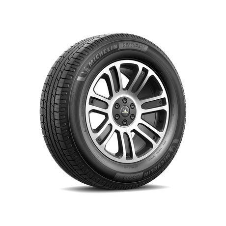 Michelin Defender2 All-Season Tire, 215/55R17 94V — Single Michelin Defender2 all-season tire standing upright, sidewall facing the camera with the tread visible at an angle