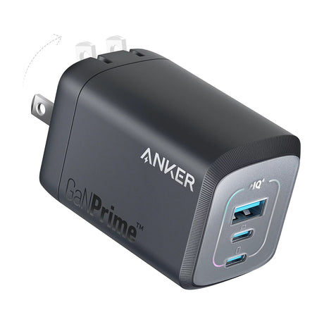 Anker Prime Charger, 100W 3-Port GaN USB-C Wall Charger with Foldable Plug — Anker Prime 100W three-port GaN wall charger in black, plug folded out, front three-quarter view showing the two USB-C ports and one USB-A port, on a white background