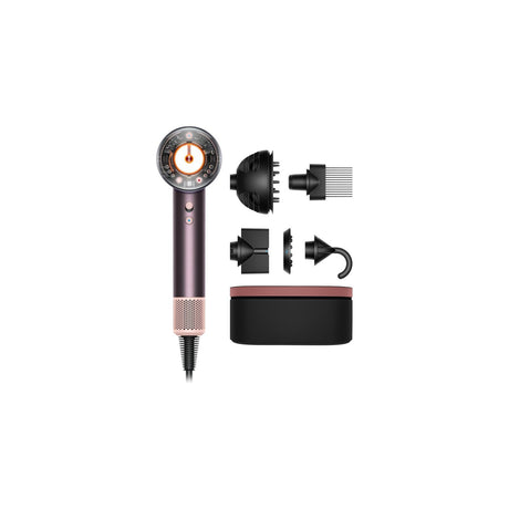 Dyson Supersonic Nural Hair Dryer — Dyson Supersonic Nural hair dryer standing upright with the ring nozzle facing forward and one magnetic attachment beside it on a plain background