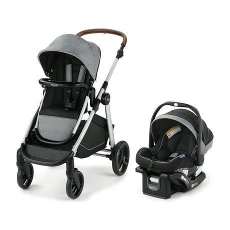 Graco Modes Nest2Grow 4-in-1 Travel System with SnugRide 35 Lite Elite Infant Car Seat — Graco Modes Nest2Grow travel system, side three-quarter view of the stroller with the SnugRide infant car seat clicked onto the frame