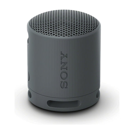 Sony SRS-XB100 Portable Bluetooth Speaker, Waterproof, Black — Sony SRS-XB100 compact cylindrical Bluetooth speaker in black with its wrist strap, three-quarter view on a plain background