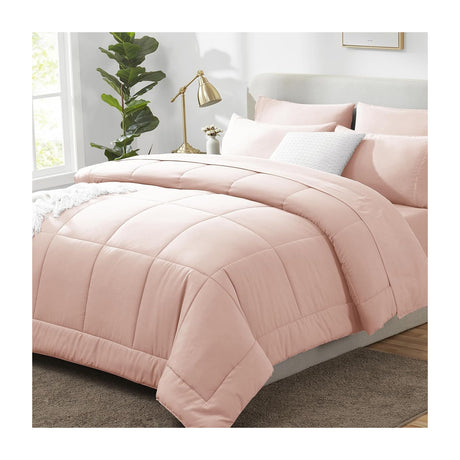 Better Home 8-Piece Comforter Set, Bed in a Bag with Sheets — A made bed dressed in a gray eight-piece comforter set with matching shams and bed skirt, shown from the foot of the bed