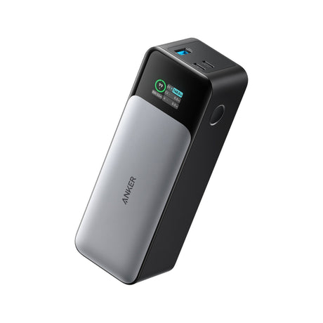 Anker 737 Power Bank (PowerCore 24K), 24,000mAh 140W Portable Charger with Smart Display — Anker 737 Power Bank standing upright in black, smart display lit and showing charge percentage, three ports facing forward