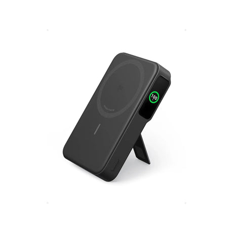 Anker MagGo Power Bank 10,000mAh Qi2 15W Magnetic — Anker MagGo magnetic power bank in black, shown standing with its kickstand out and the small battery display lit, three-quarter view on a white background