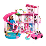 Barbie Dreamhouse Playset, 3 Stories with Pool, Slide and Elevator, 75+ Pieces — Fully assembled pink Barbie Dreamhouse, three stories with pool and slide, front view on a white background