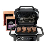 Ninja Woodfire 7-in-1 Outdoor Grill & Smoker, Electric, OG701 — Ninja Woodfire OG701 outdoor electric grill in grey with the lid open showing the grill grate, front three-quarter view