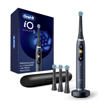 Oral-B iO Series 9 Rechargeable Electric Toothbrush with Charging Travel Case — Oral-B iO Series 9 electric toothbrush handle standing upright with brush head attached, display facing camera