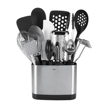 OXO Good Grips 15-Piece Everyday Kitchen Utensil Set — OXO Good Grips 15-piece kitchen utensil set standing in its stainless steel holder, black-handled tools fanned outward, on a plain background
