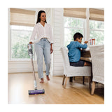 Shark Detect Pro Cordless Stick Vacuum with Auto-Empty System, IW3511 — Shark Detect Pro cordless stick vacuum in white and brass standing in its auto-empty charging dock, full height on a plain background